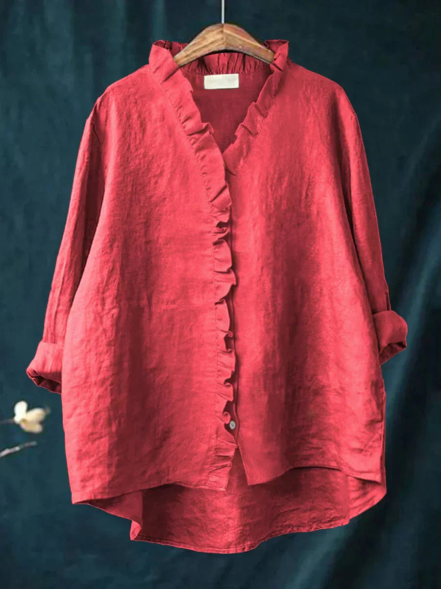 A light feminine top with delicate ruffle details along the neckline and front, available in multiple colours