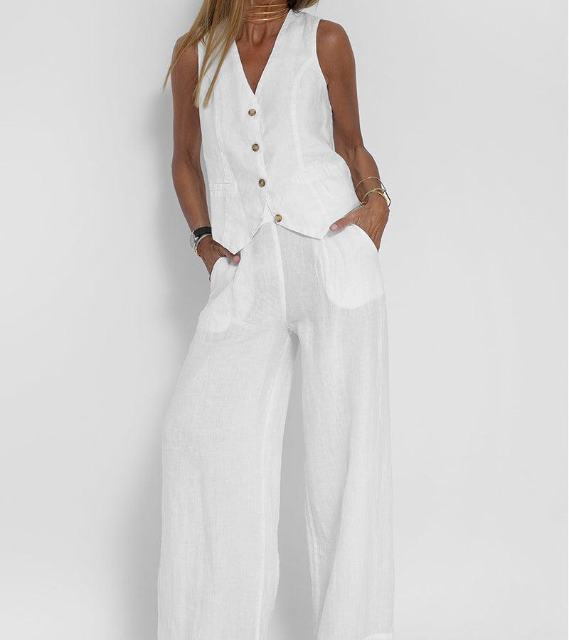 A woman wearing a tailored waistcoat with flowing wide-leg trousers