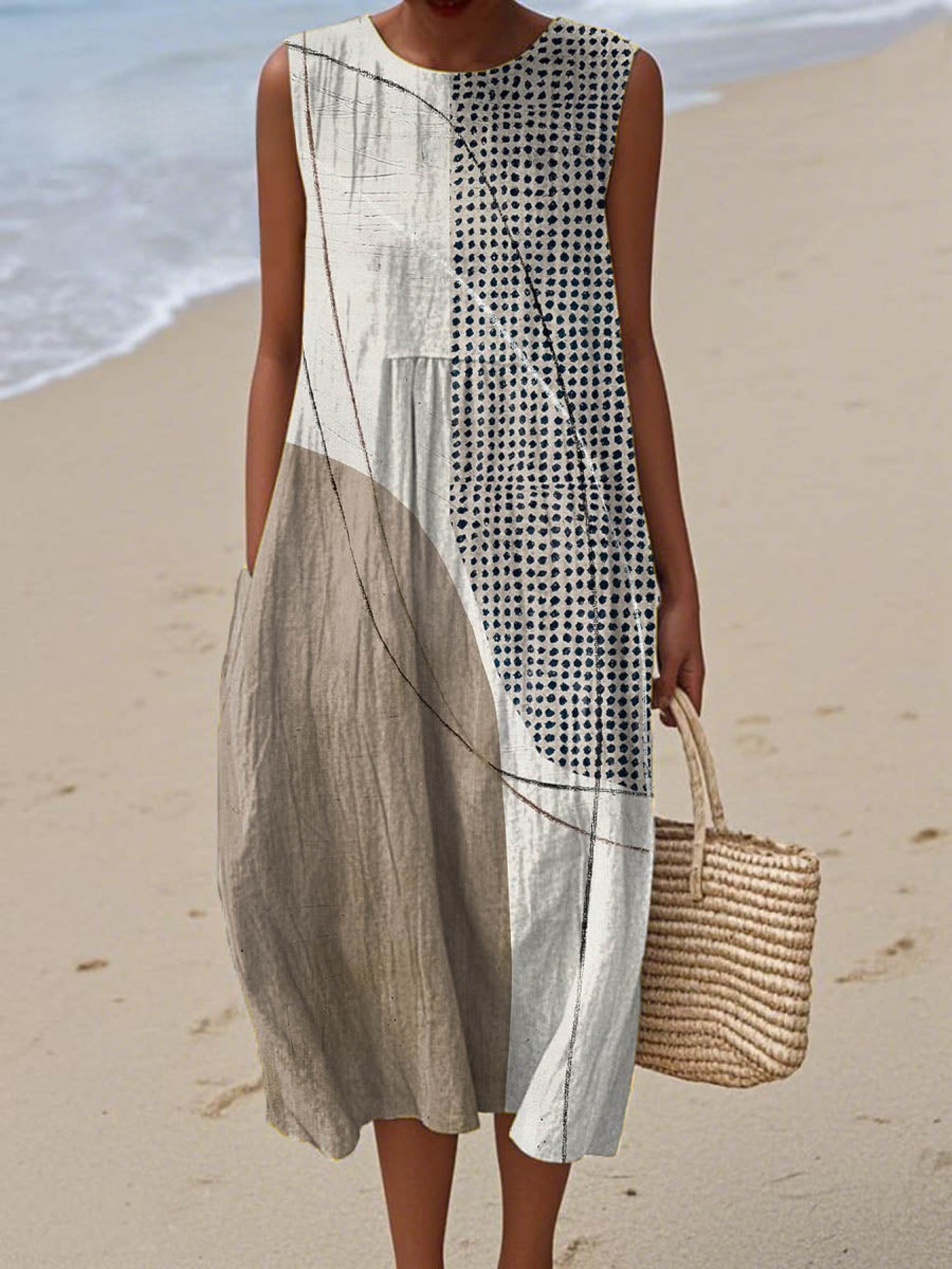 Sleeveless wrap dress with an abstract geometric print and handy side pockets