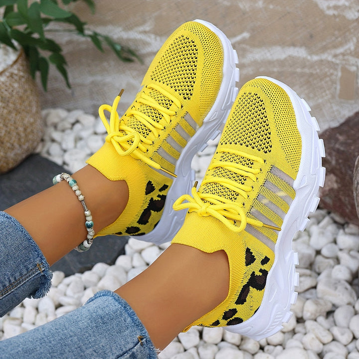 A woman walking in light, breathable comfort trainers on a warm day.