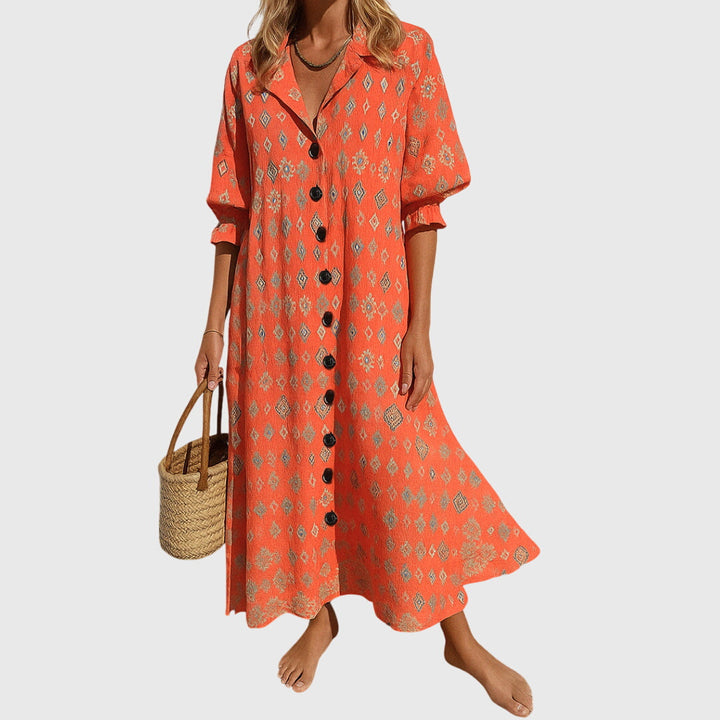 Woman wearing a romantic bohemian maxi dress with delicate patterns and a softly draped silhouette.