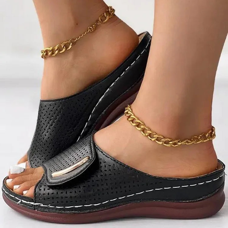 Open-work wedge sandals in bordeaux with a small metallic ornament on the upper