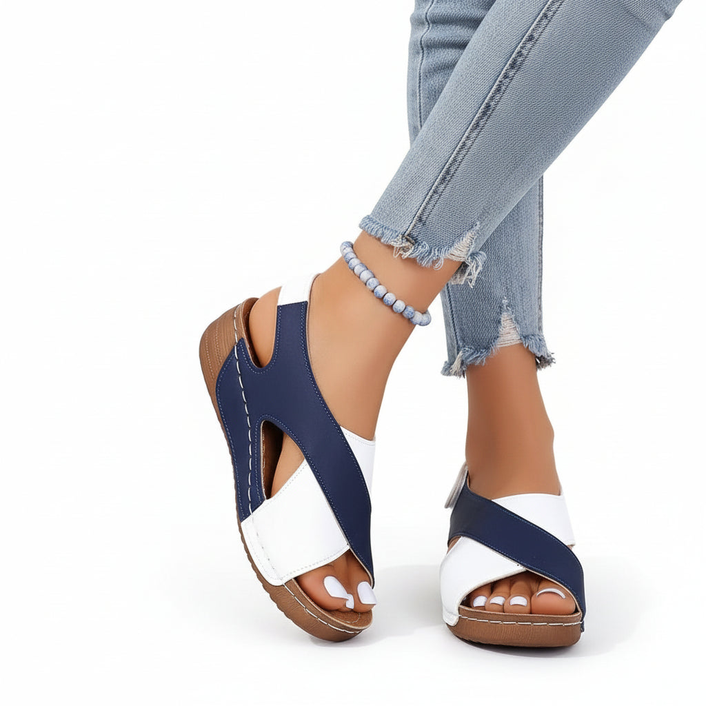 Women's wide-strap daily sandals in navy and white with a low supportive wedge