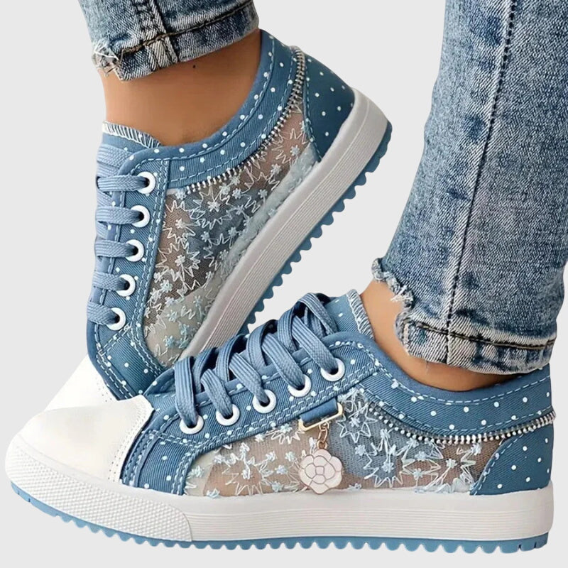 A woman walking comfortably in blue cushioned orthopaedic trainers