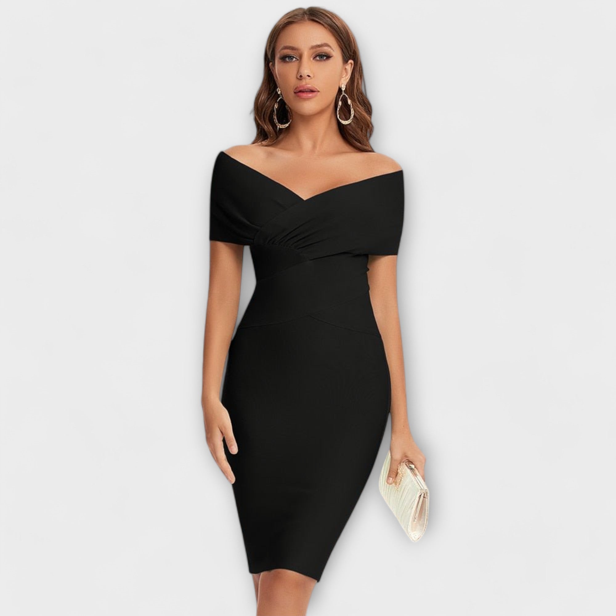 A fluid V-neck midi dress in black, draped elegantly and styled for a smart occasion