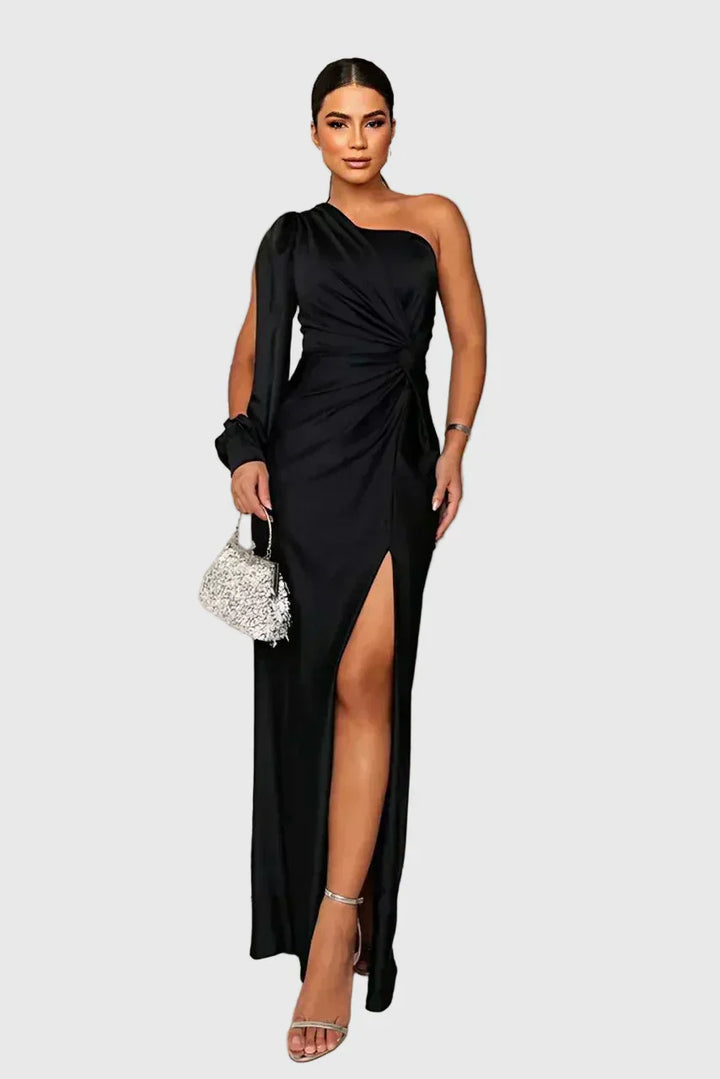Woman wearing a long flowing evening maxi dress with elegant, graceful lines.