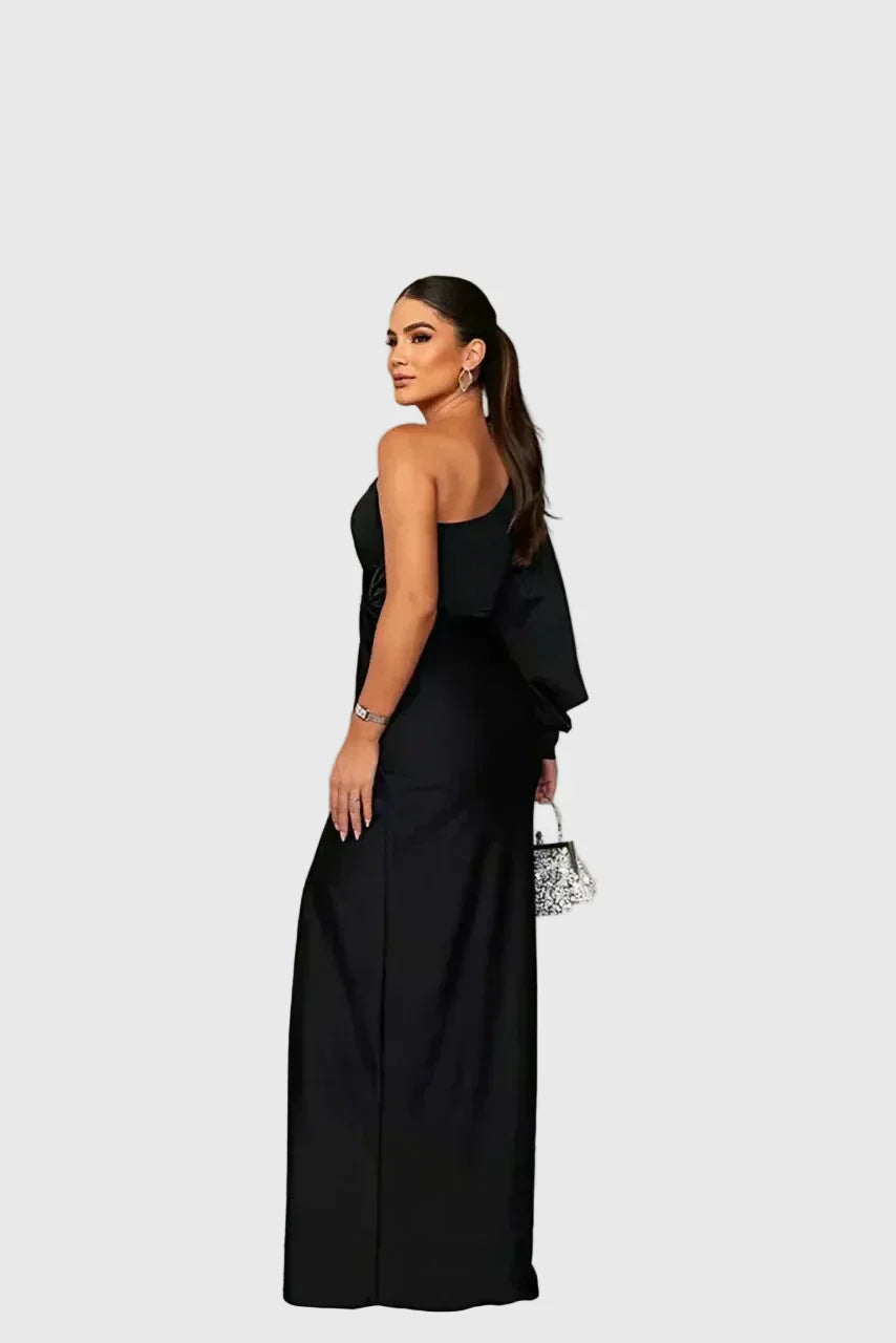 Woman wearing a long flowing evening maxi dress with elegant, graceful lines.