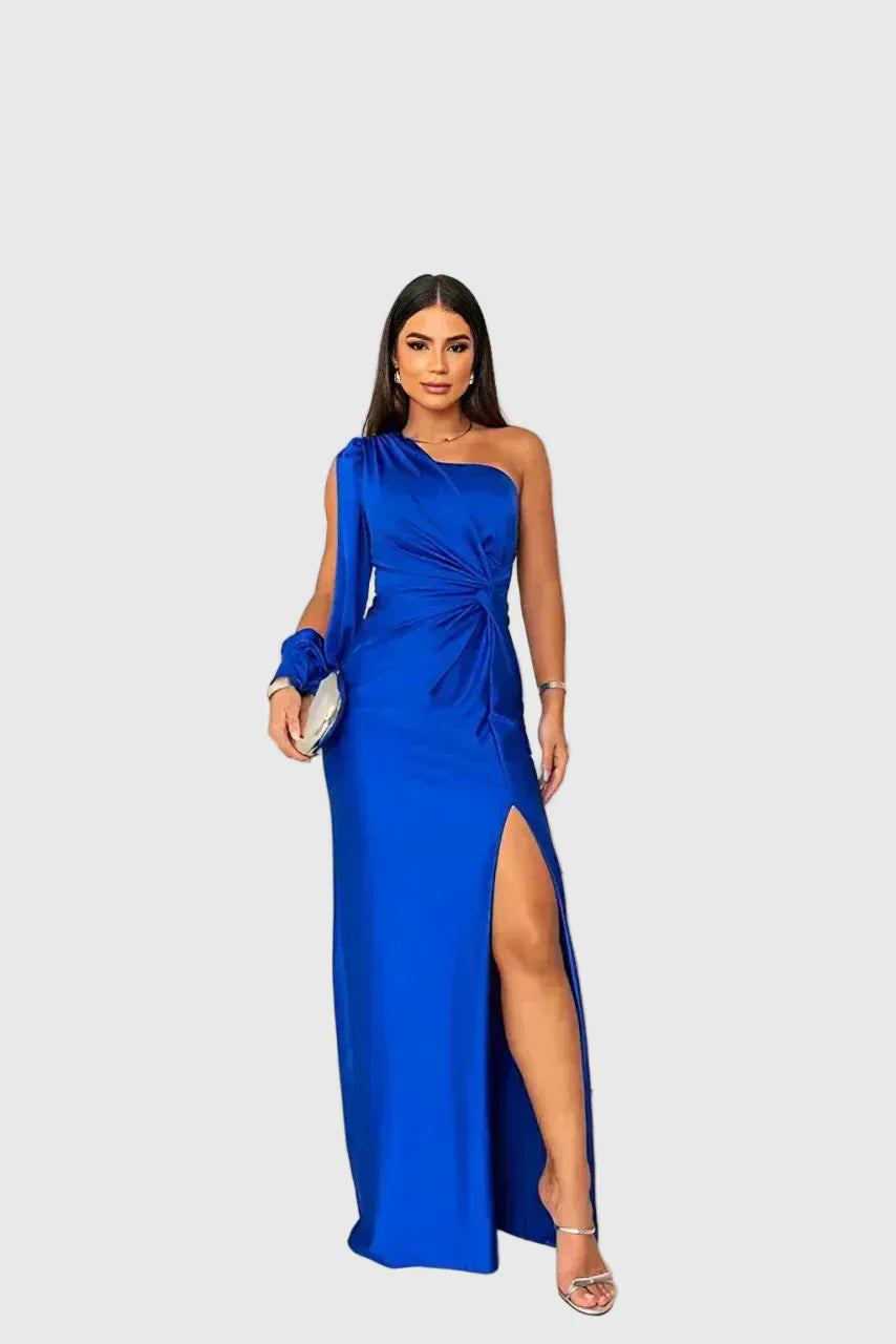Woman wearing a long flowing evening maxi dress with elegant, graceful lines.