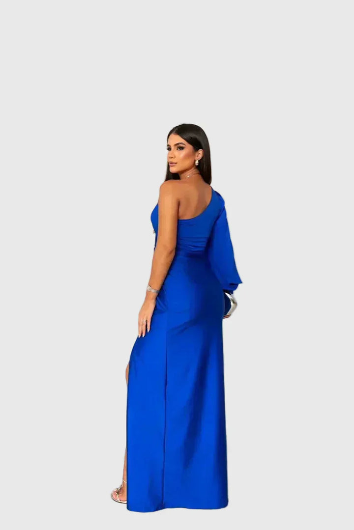 Woman wearing a long flowing evening maxi dress with elegant, graceful lines.