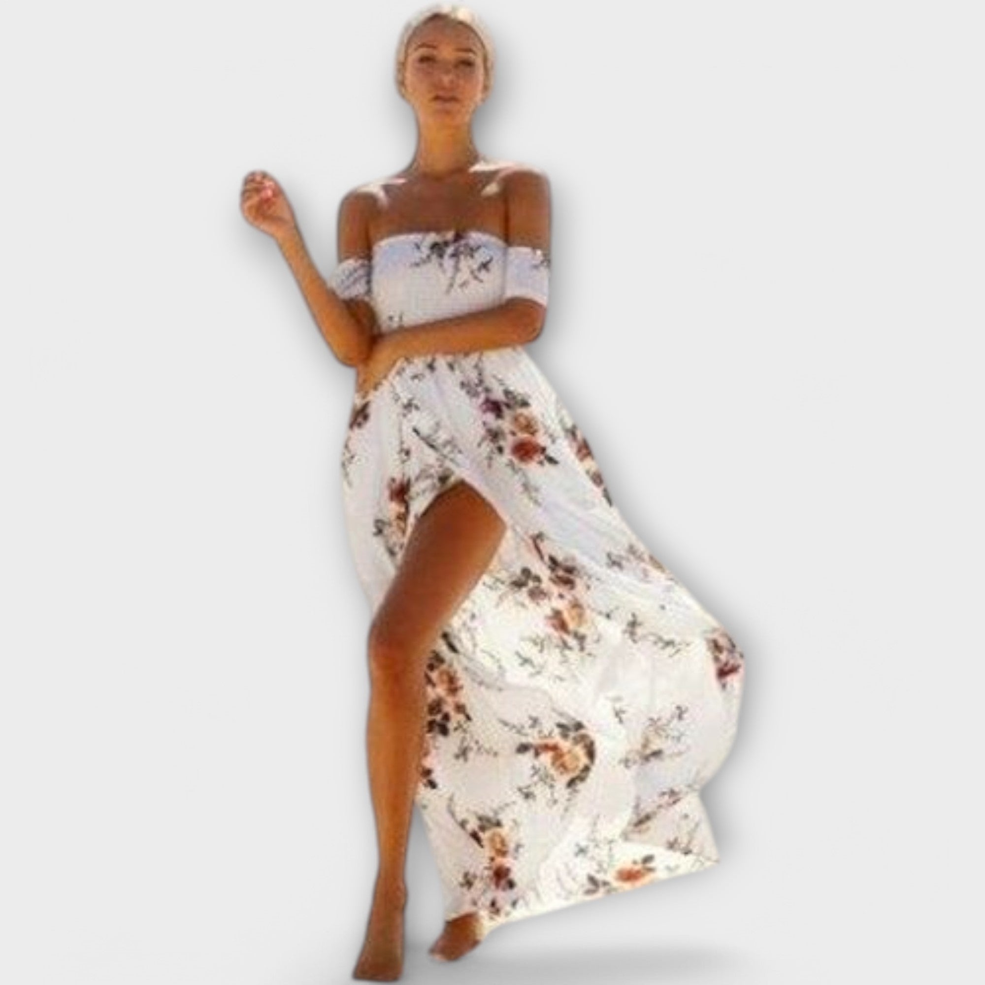 A white floral fluid midi dress with a gentle boho print, styled for a relaxed summer outing