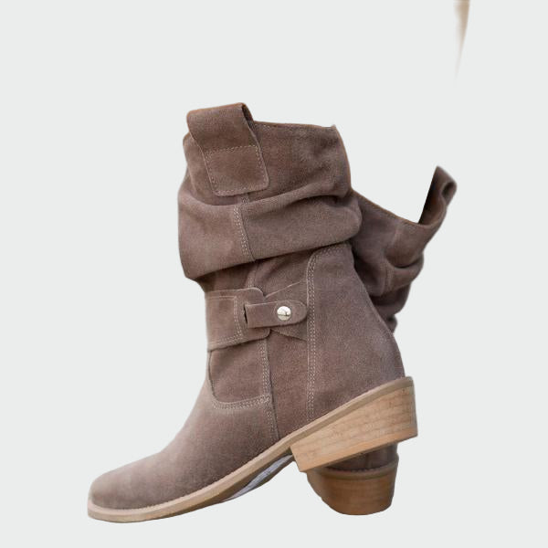 Beige wide-top calf boots with a decorative metal buckle and low heel