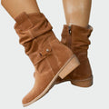 Beige wide-top calf boots with a decorative metal buckle and low heel