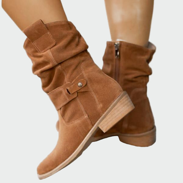 Beige wide-top calf boots with a decorative metal buckle and low heel