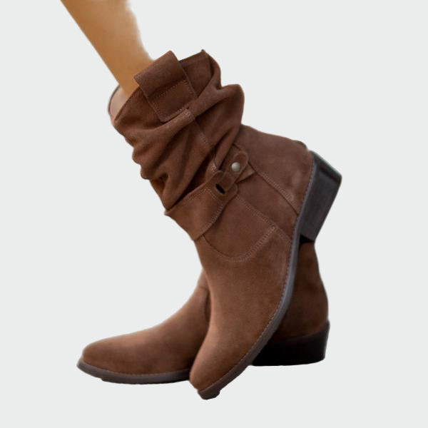 Beige wide-top calf boots with a decorative metal buckle and low heel