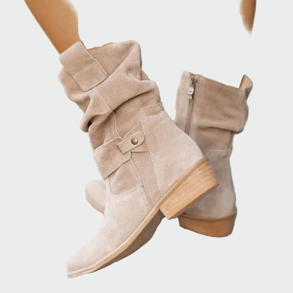 Beige wide-top calf boots with a decorative metal buckle and low heel