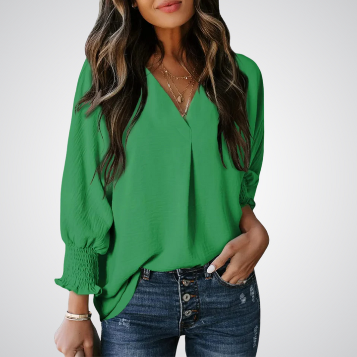 Apricot V-neck tunic blouse with gently ruched flutter sleeves and a flowing relaxed fit