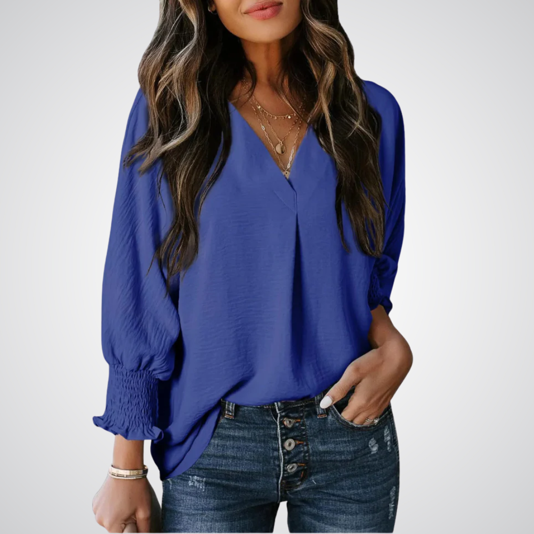 Apricot V-neck tunic blouse with gently ruched flutter sleeves and a flowing relaxed fit