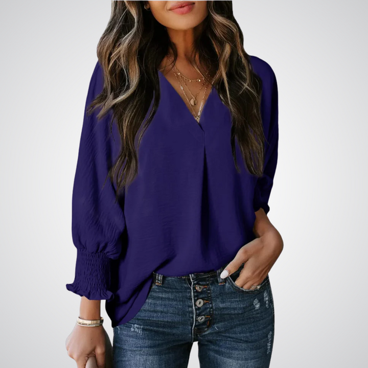 Apricot V-neck tunic blouse with gently ruched flutter sleeves and a flowing relaxed fit