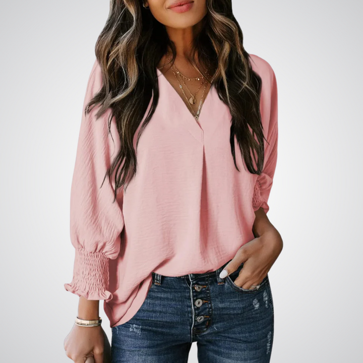 Apricot V-neck tunic blouse with gently ruched flutter sleeves and a flowing relaxed fit