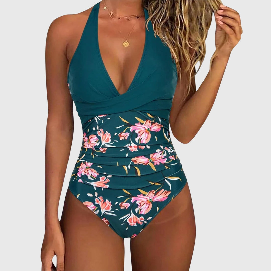 One-piece swimsuit with V-neckline and floral detail in a fresh green tone