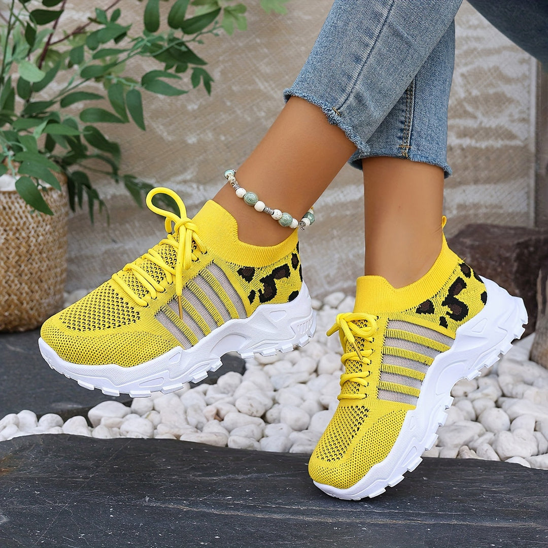 A woman walking in light, breathable comfort trainers on a warm day.