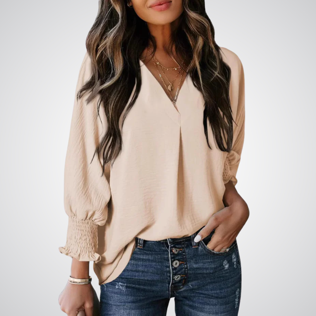 Apricot V-neck tunic blouse with gently ruched flutter sleeves and a flowing relaxed fit