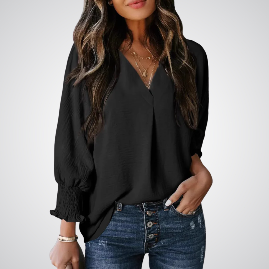 Apricot V-neck tunic blouse with gently ruched flutter sleeves and a flowing relaxed fit