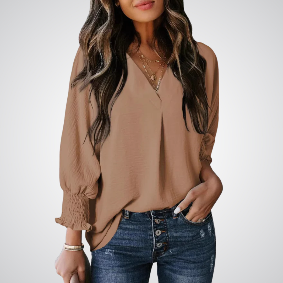 Apricot V-neck tunic blouse with gently ruched flutter sleeves and a flowing relaxed fit
