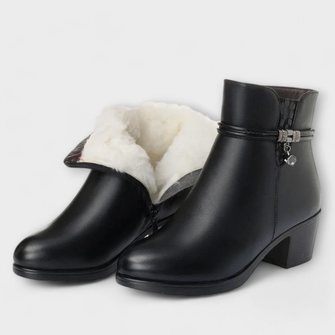 Heeled zip winter boots in brown and black with a smooth upper and elegant silhouette