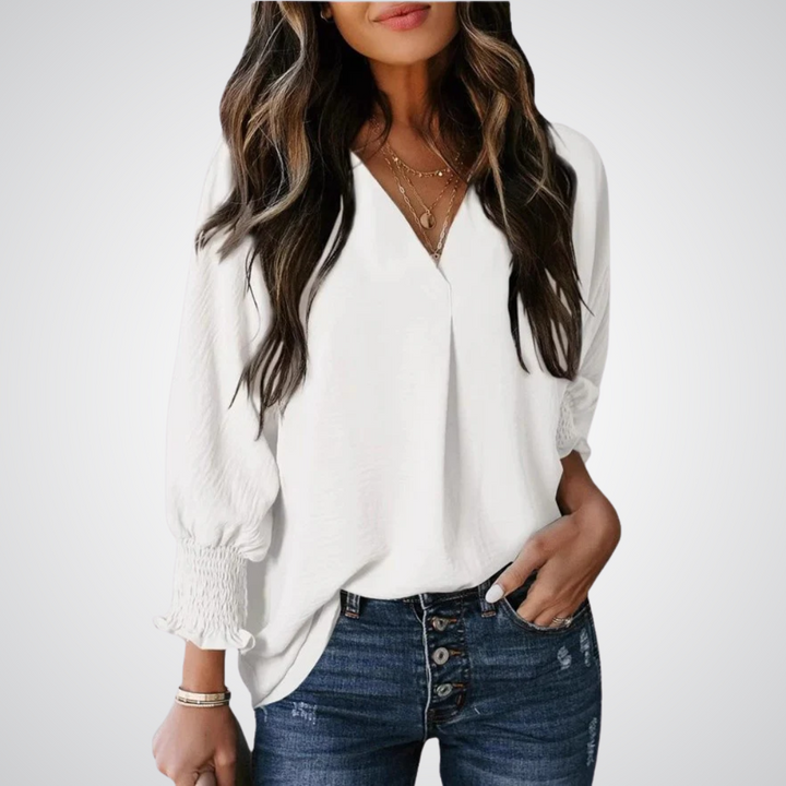 Apricot V-neck tunic blouse with gently ruched flutter sleeves and a flowing relaxed fit