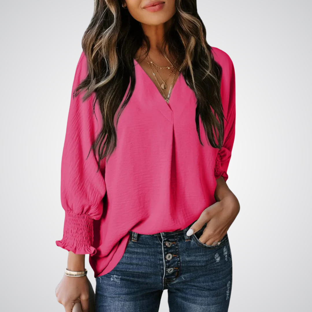 Apricot V-neck tunic blouse with gently ruched flutter sleeves and a flowing relaxed fit