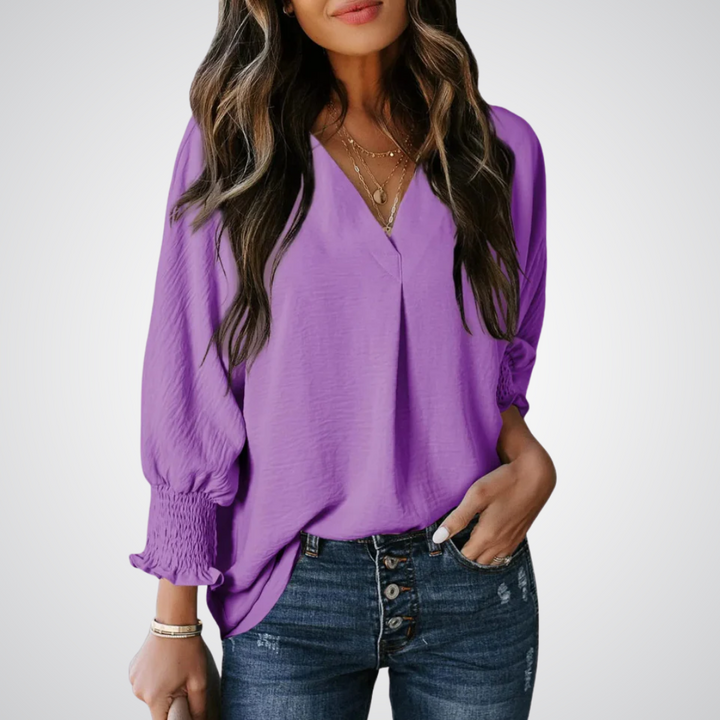 Apricot V-neck tunic blouse with gently ruched flutter sleeves and a flowing relaxed fit