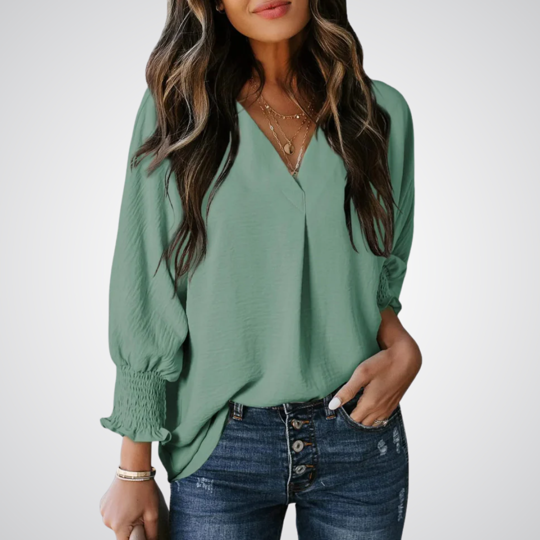 Apricot V-neck tunic blouse with gently ruched flutter sleeves and a flowing relaxed fit