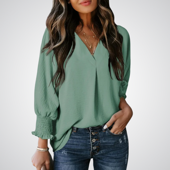 Apricot V-neck tunic blouse with gently ruched flutter sleeves and a flowing relaxed fit