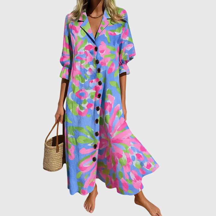 Woman wearing a romantic bohemian maxi dress with delicate patterns and a softly draped silhouette.