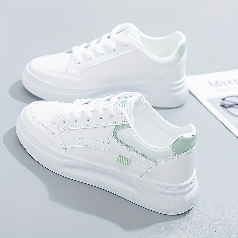 A woman in crisp white light comfort trainers paired with jeans.