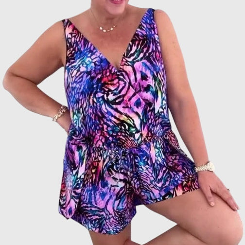 Women's swim dress in blue, purple and green with an elegant skirt silhouette