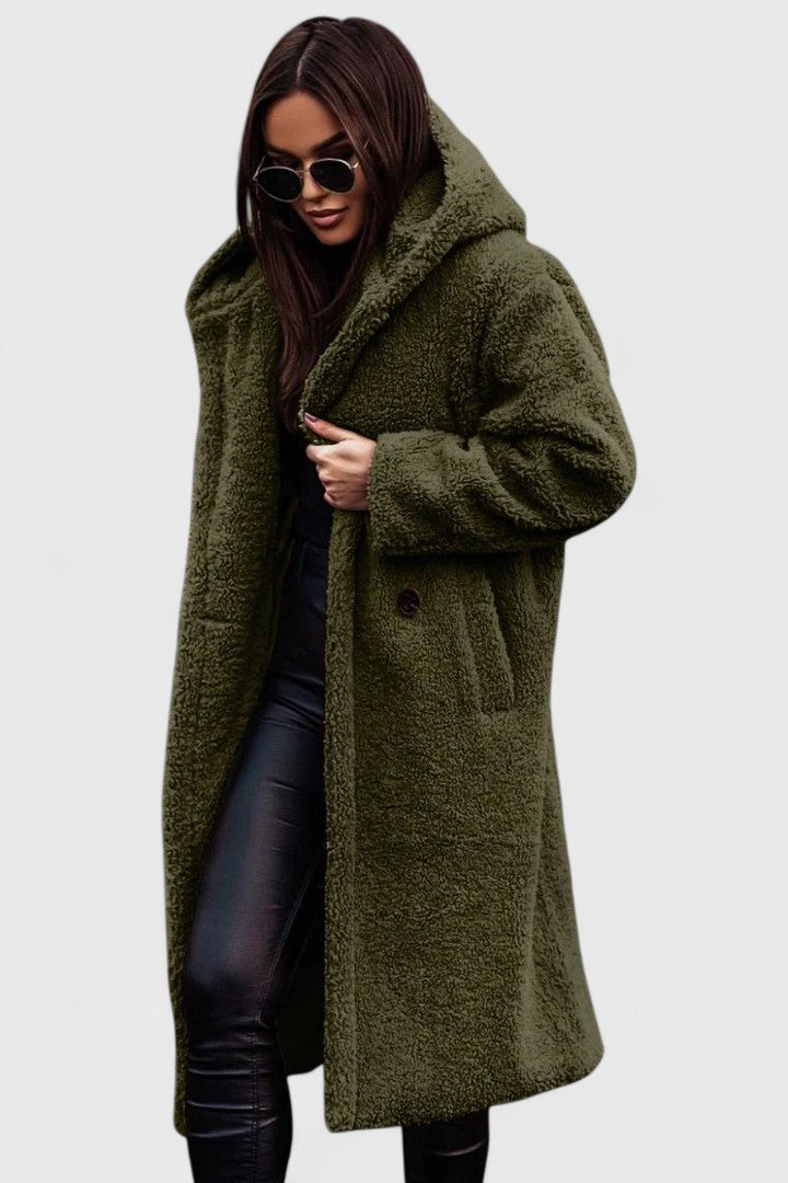 A woman wearing an elegant winter jacket on a cold day in town