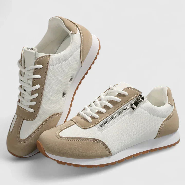 A woman wearing orthopaedic shoes with a supportive heel and a subtle lift