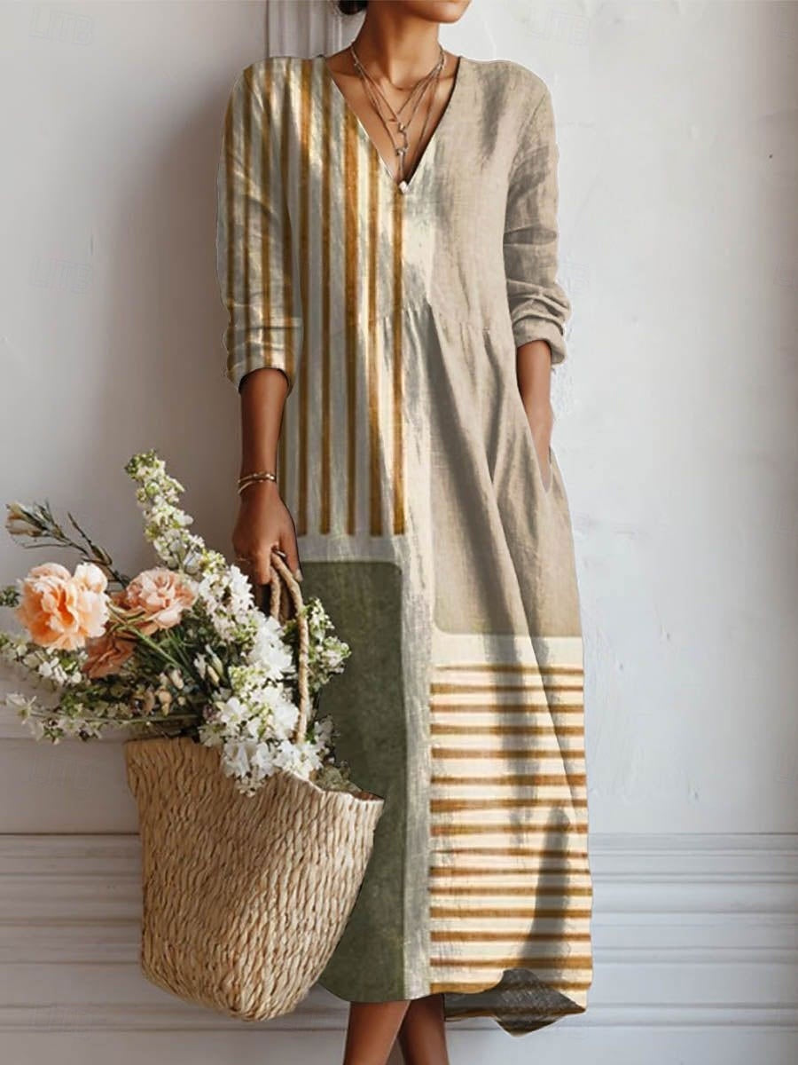 A woman wearing a soft, flowing day dress, relaxed and elegant as she heads out.