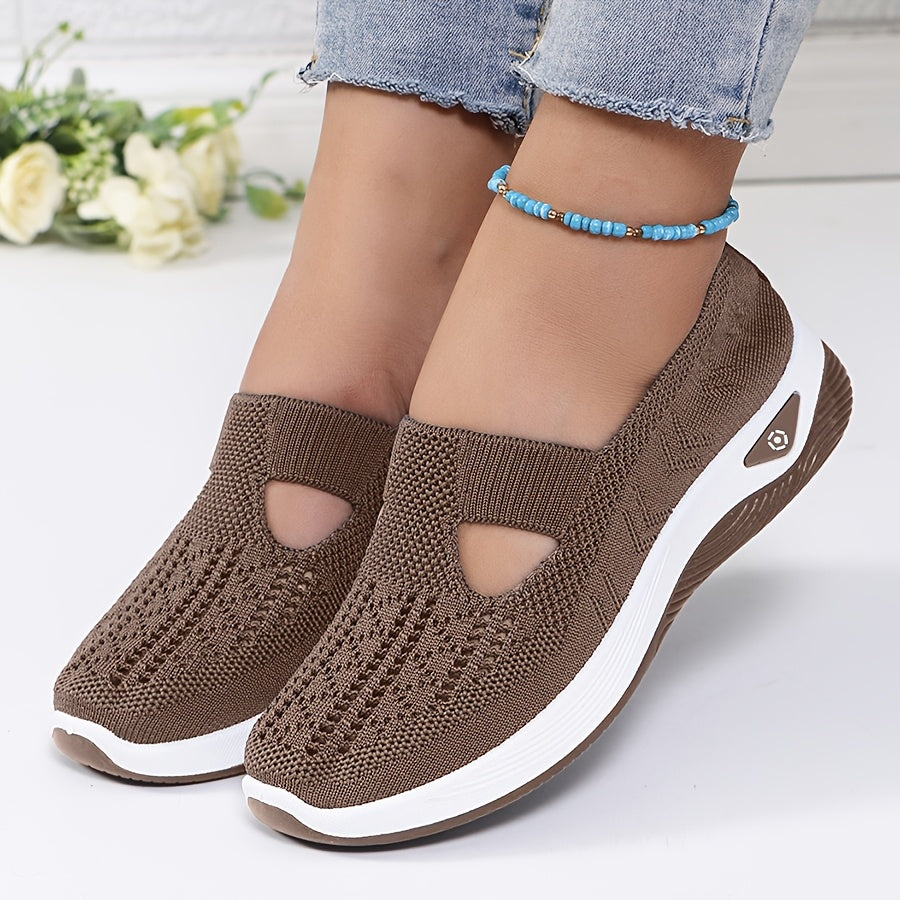 A woman stepping into easy slip-on comfort trainers with no laces.