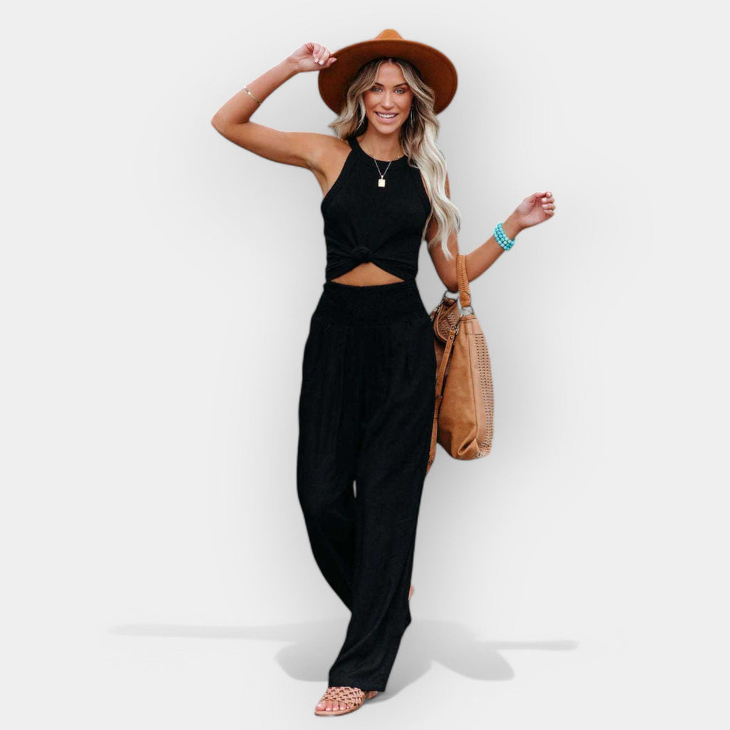 White wide-leg trousers with an elastic waist and a light, flowing silhouette