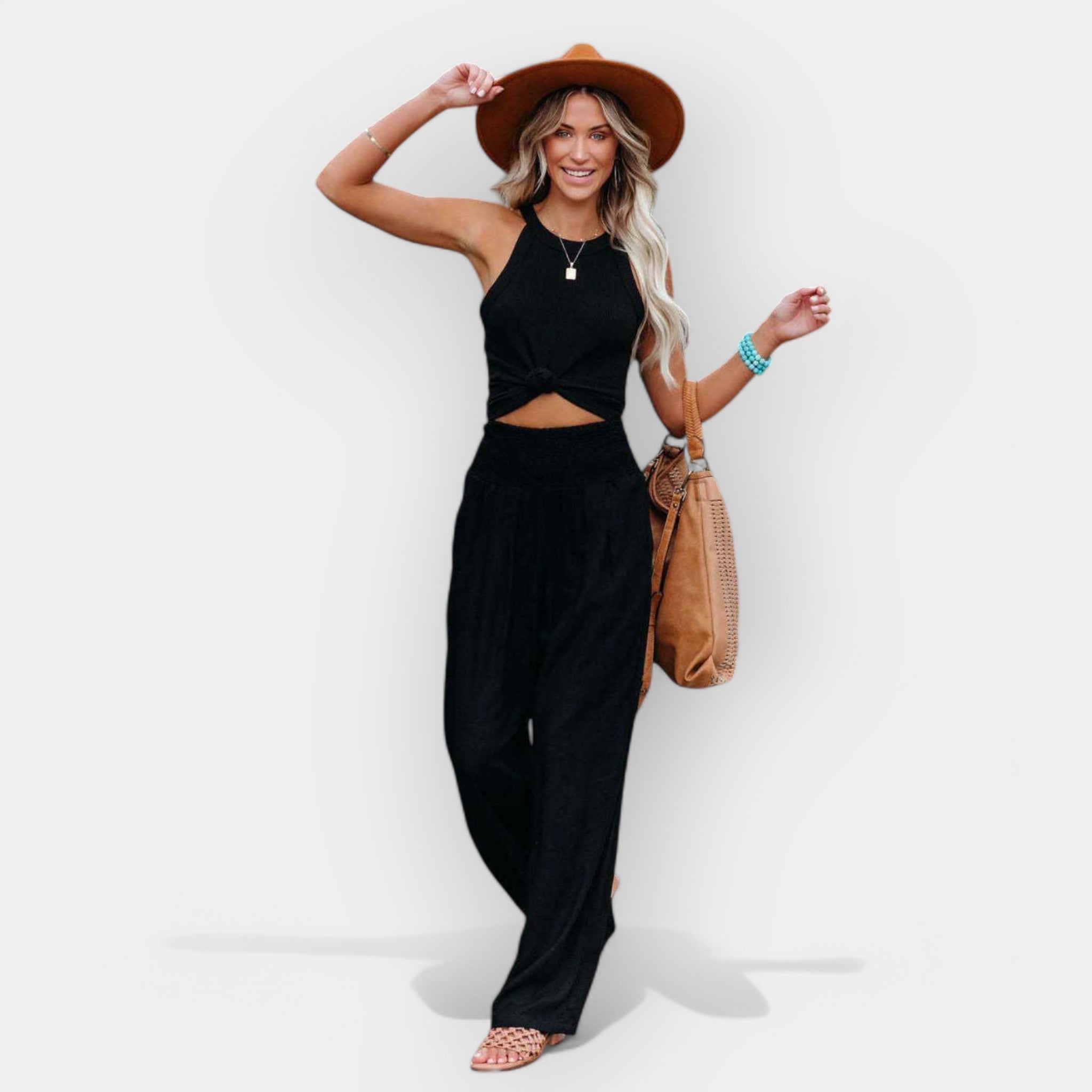 White wide-leg trousers with an elastic waist and a light, flowing silhouette