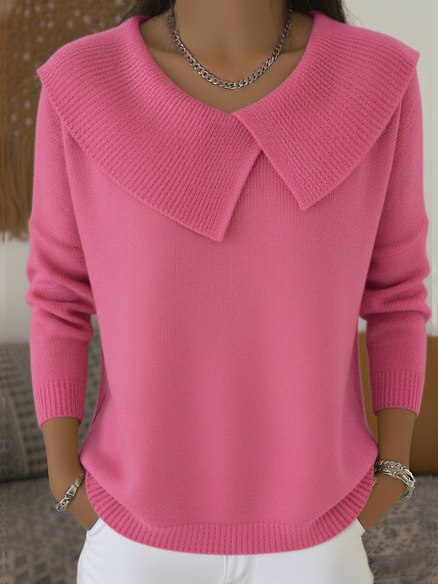 A woman wearing a soft collared jumper styled elegantly for a festive occasion.