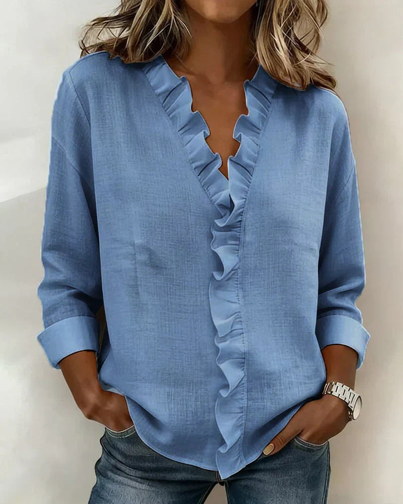Pink women's V-neck blouse with decorative frill collar and long sleeves