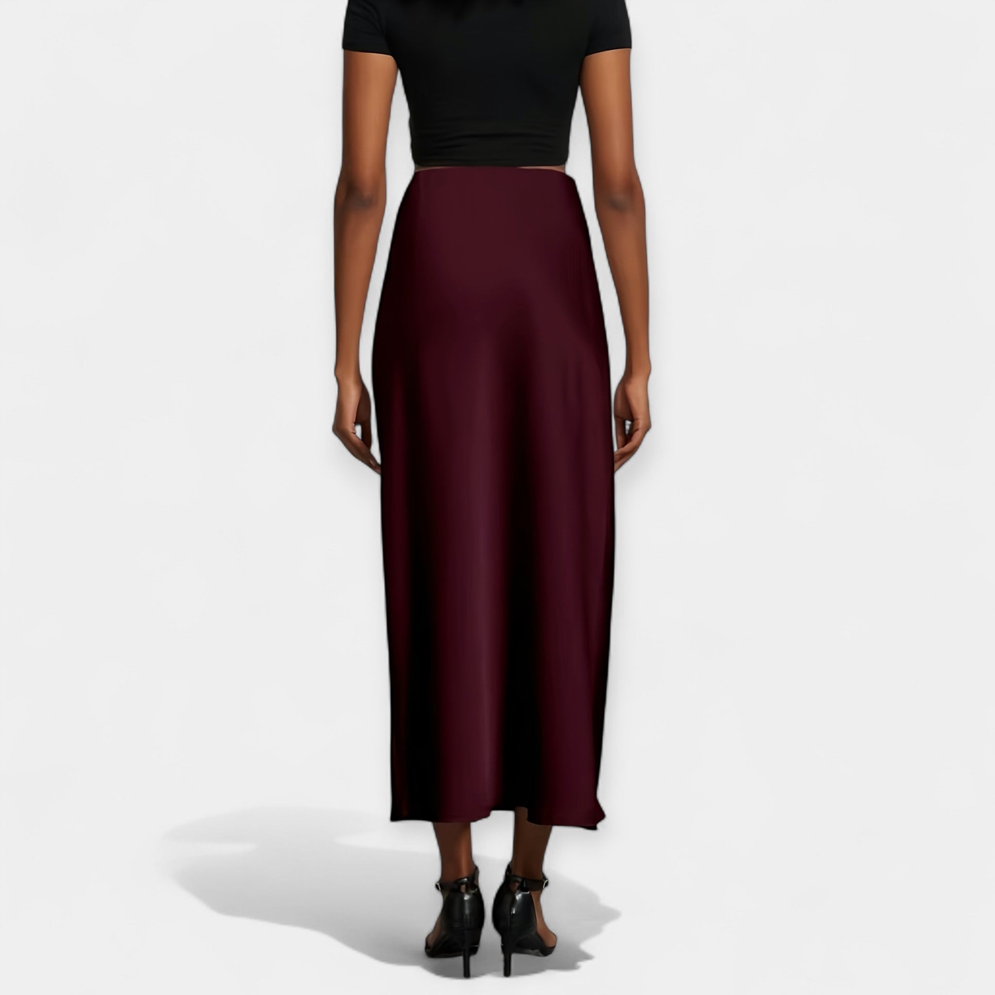 High-waist smooth midi skirt in black with a flowing wide-cut silhouette and lustrous finish