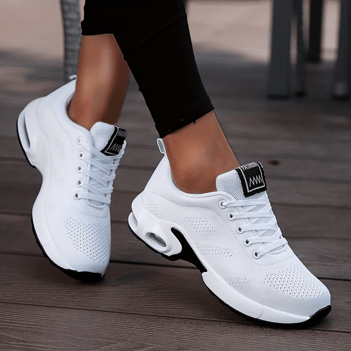 A woman walking further in breathable, air-cushioned non-slip trainers.