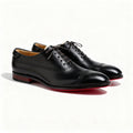 Men's black executive closed-toe shoes with a sharp polished silhouette and contrasting sole