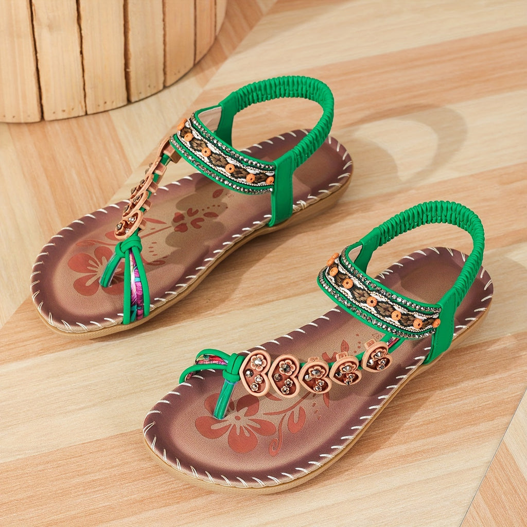 Beaded boho flat sandals in brown with decorative bead detailing and an elastic ankle strap