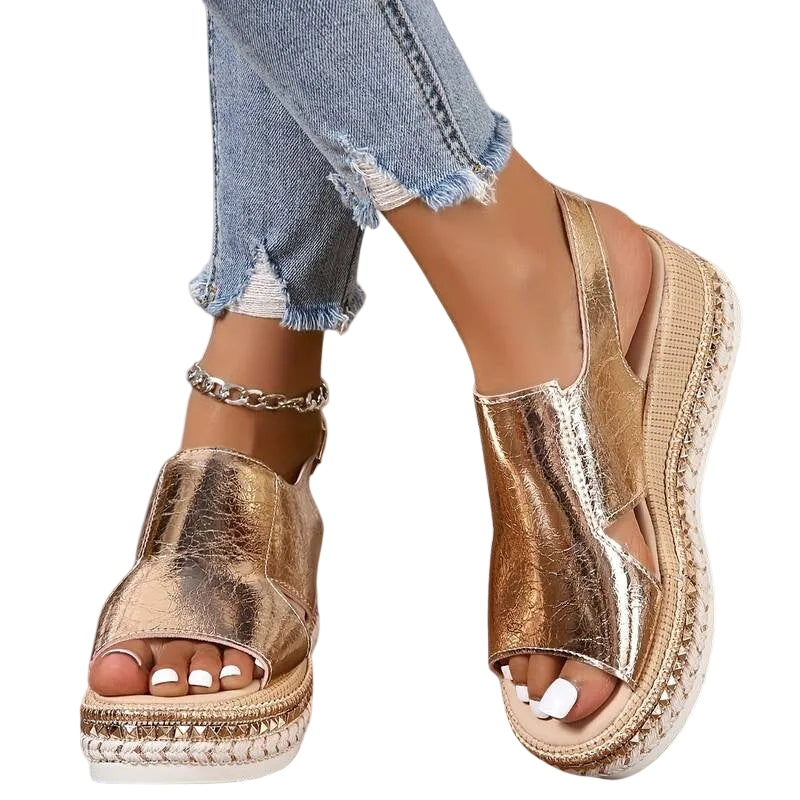 Metallic gold platform sandals with a detailed sole and cushioned footbed